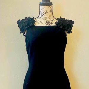 Black, timeless, knee length cocktail dress with built in shape wear.